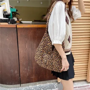 Fashionable leopard print canvas shoulder bag for women, large capacity casual crossbody shopping bag.