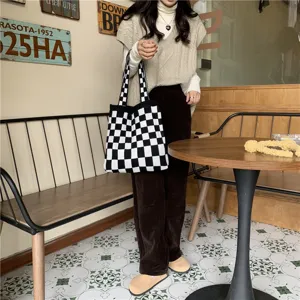 Knitted checkerboard tote bag for women, casual black and white large capacity shoulder bag.