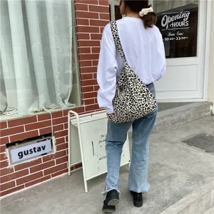 Leopard print canvas shoulder bag, large capacity crossbody shopping bag for women street style.