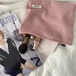 Pink corduroy makeup bag with cute woven label, large capacity portable cosmetic pouch.