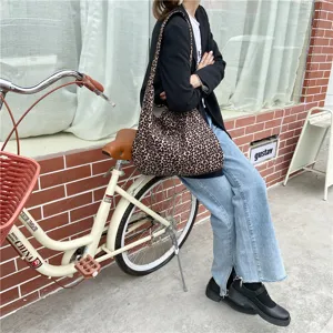 Leopard print canvas shoulder bag detail showing large capacity, stylish daily street style.