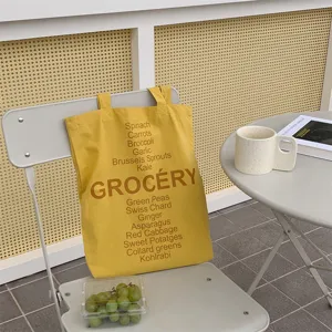 Yellow canvas tote bag with vegetable print grocery design casual shoulder handbag daily use detail