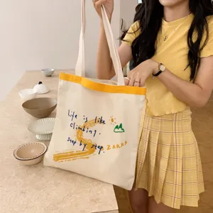 Canvas tote bag for women, aesthetic yellow strap shoulder bag with cute letter embroidery.