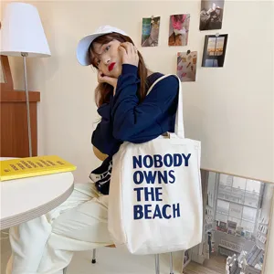 Korean style simple letter canvas tote bag for women, large capacity daily shoulder shopping bag.