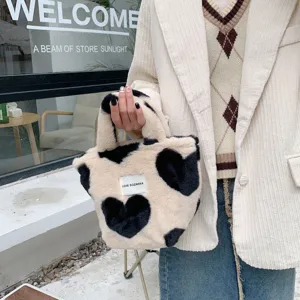 Japanische Plüschhandtasche mit süßem schwarzen Herzmuster, weiche flauschige Tasche für den Alltag.