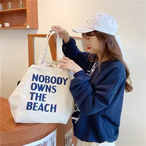 Casual large capacity canvas tote bag for women, minimalist letter printed shoulder bag.