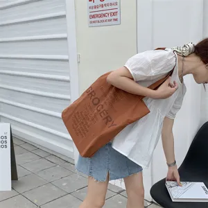 Casual canvas tote bag for women, stylish grocery letter print shoulder bag for daily use.