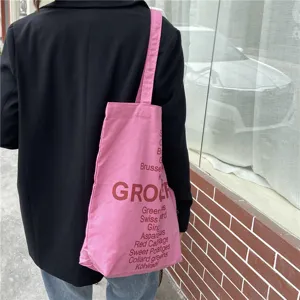 Pink canvas tote bag for women, casual shoulder shopping bag with grocery letter print.