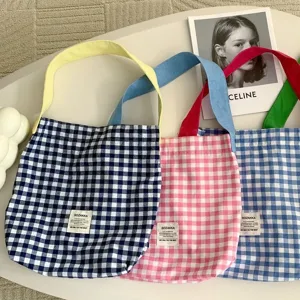 Canvas tote bag for women, stylish plaid shoulder bag with contrast color straps for daily commute.