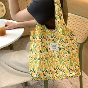Floral canvas tote bag for women, cute tulip pattern shoulder bag with large capacity daily use.