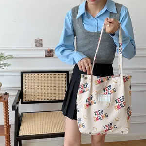 Stylish corduroy canvas tote bag for women, with colorful letter print and spacious capacity.