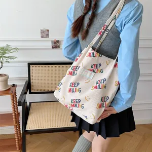 Casual corduroy tote bag with colorful print, stylish shoulder bag for daily commute and school.