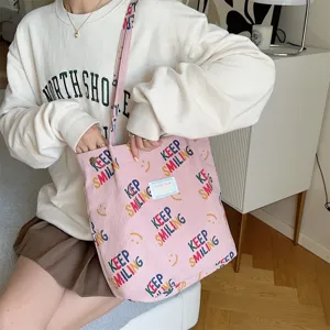 Pink corduroy tote bag with keep smiling print, large capacity casual shoulder bag for daily use.