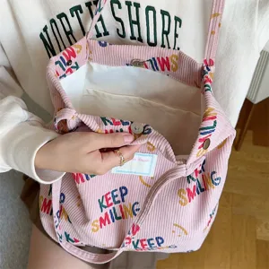 Pink corduroy tote bag for women, large capacity shoulder shopping bag with cute letter prints.