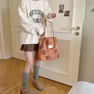 Casual corduroy tote bag for women, large capacity shoulder bag for daily commute and school.