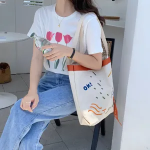 Sac cabas en toile avec sangle contrastée et broderie mignonne, grande capacité pour usage quotidien.