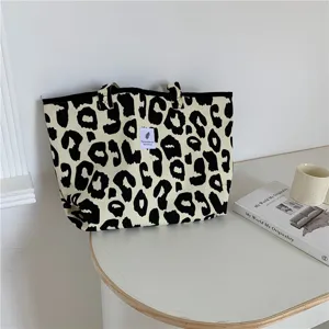 Leopard print canvas tote bag, large capacity casual shoulder bag for women daily use style.