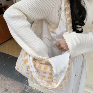 Detailed view of large capacity waffle fleece tote bag featuring chic checkerboard pattern.