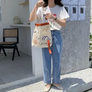 Sac cabas en toile avec sangle contrastée et broderie mignonne, style décontracté.
