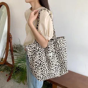 Closeup detail view of the vintage leopard print canvas tote bag, featuring spacious casual design.