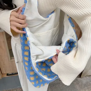 Detailed view of fluffy blue and yellow checkered tote bag interior with multiple white pockets.