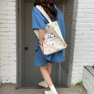 Sac cabas en toile pour femmes, sac à bandoulière brodé de grande capacité, sac fourre-tout étudiant.