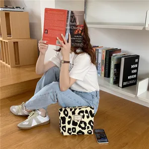 Beige leopard print canvas tote bag, stylish large capacity shoulder handbag for women.