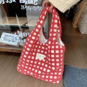 Red and white checkered plush tote bag, fluffy fleece material, casual daily carry detail view.