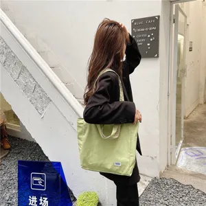 Japanese style casual canvas tote bag, versatile light green double-sided shoulder bag for students.