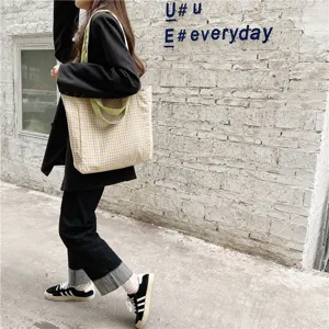 Casual plaid canvas tote bag for women, stylish student shoulder bag with green handles.
