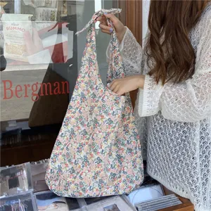 Floral print canvas shoulder bag, sweet aesthetic student tote bag with tied strap.