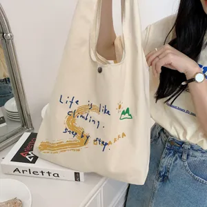 Casual canvas tote bag with inspiring embroidery, large capacity daily shoulder handbag.