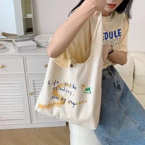 Casual canvas tote bag with inspirational text print, large capacity, perfect for daily use.