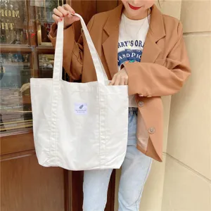 Sac cabas fourre-tout en toile blanche minimaliste pour femme, grand format et grande capacité.