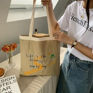 Casual canvas tote bag with inspiring English print, large capacity daily shoulder bag.
