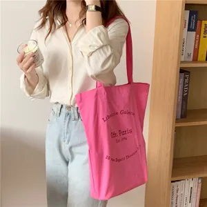 Pink canvas shoulder bag with stylish letter print for women casual daily wear chic aesthetic.