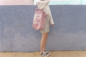 Pink canvas tote bag with letter print, casual large capacity shoulder bag for daily use.