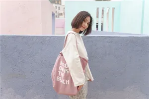 Korean minimalist pink canvas tote bag with letter print, large capacity shoulder shopping bag.