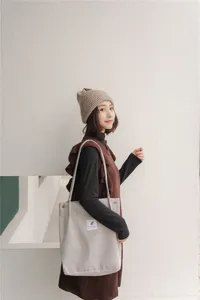 Casual corduroy shoulder tote bag for women, large capacity minimalist shopping bag style.