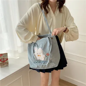 Cute corduroy shoulder bag for women, student tote bag with lovely rabbit embroidery.