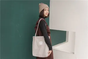 Classic corduroy shoulder tote bag for women, large capacity casual shopping handbag.