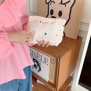 Borsa cosmetica in tela con pois colorati, grazioso borsetto per l'uso quotidiano.