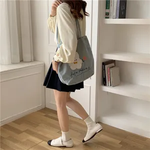 Corduroy shoulder bag for women, cute cloud embroidery casual tote bag for daily student school use.