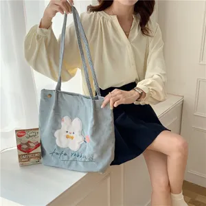 Cute corduroy shoulder bag with sweet rabbit embroidery, casual student tote bag detail view.