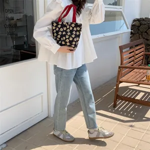 Daisy print corduroy lunch tote bag with red handle for women daily use detail shot