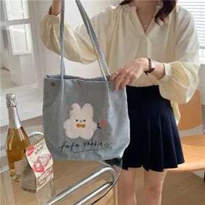 Light blue corduroy tote bag with cute cartoon rabbit embroidery, casual daily shoulder bag.