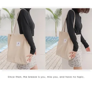 Casual corduroy tote bag lifestyle detail, spacious shoulder bag for women and students.