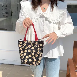 Corduroy daisy print lunch bag, portable small handbag for daily use and stylish storage.