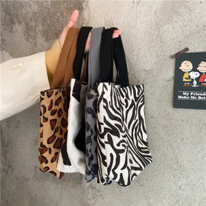 Corduroy tote handbag with cute animal prints, perfect daily lunch bag and stylish storage pouch.