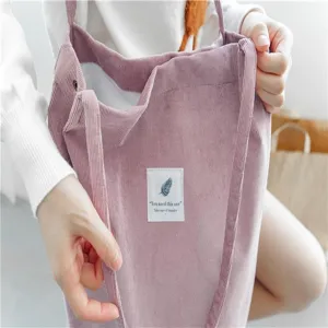 Pink corduroy tote bag for women, large capacity casual shoulder bag with snap button.